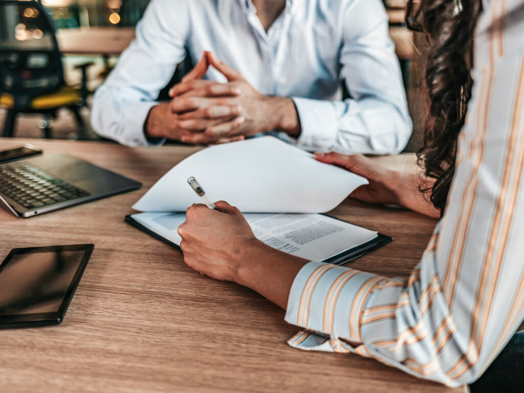 Business contract review during professional meeting