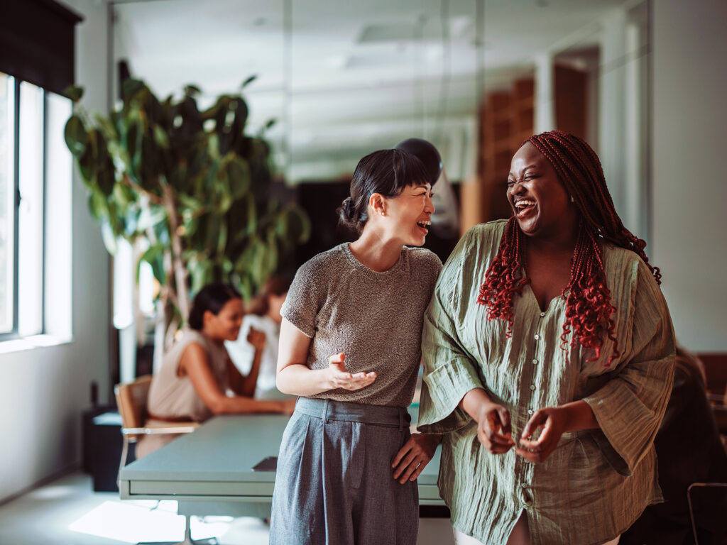 business team members talking together in office workspace